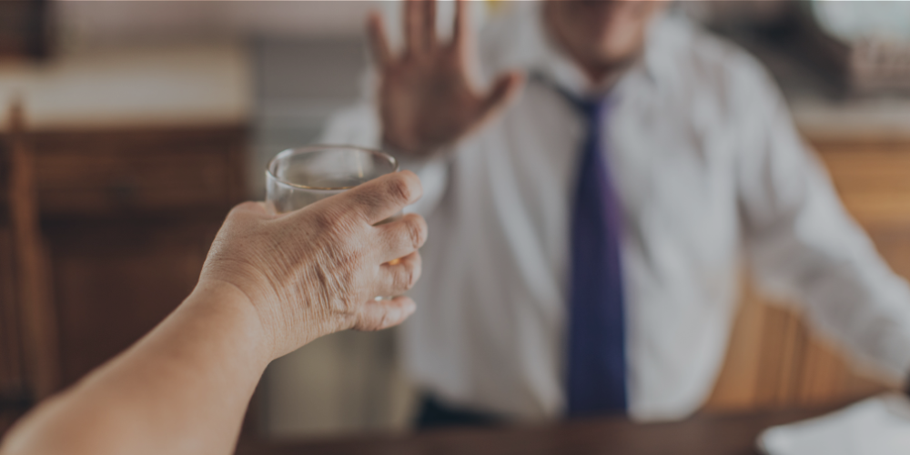 man refusing alcohol