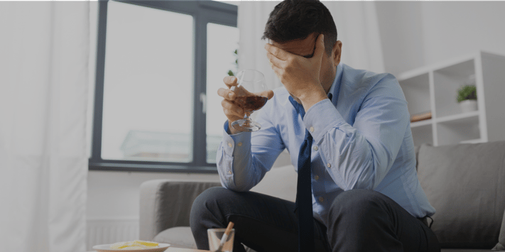 depressed man drinking alcohol
