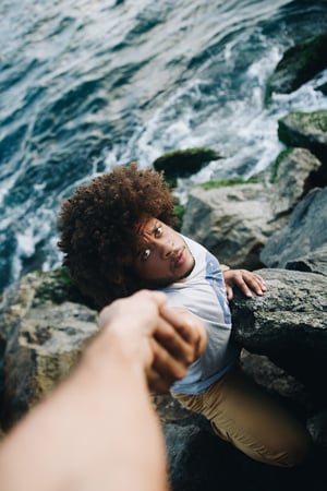 man reaching out his hand