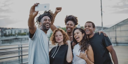 A group of happy friends having a selfie.