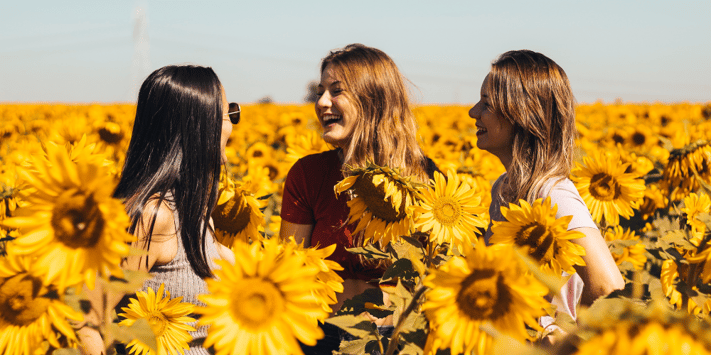 girls sunflower field