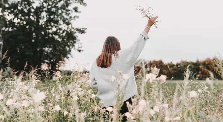 woman holding wild flowers