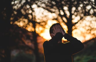 man-with-head-in-hands