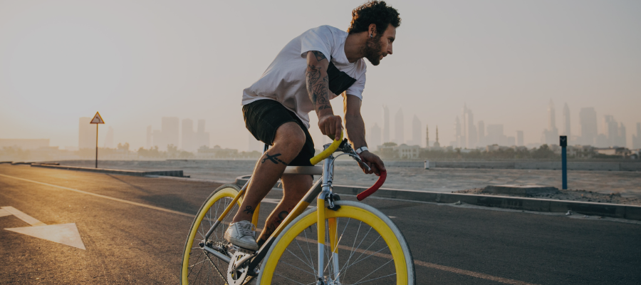 Man riding a bike exercising while going alcohol-free for 30 days