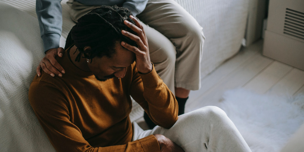 woman comforting man